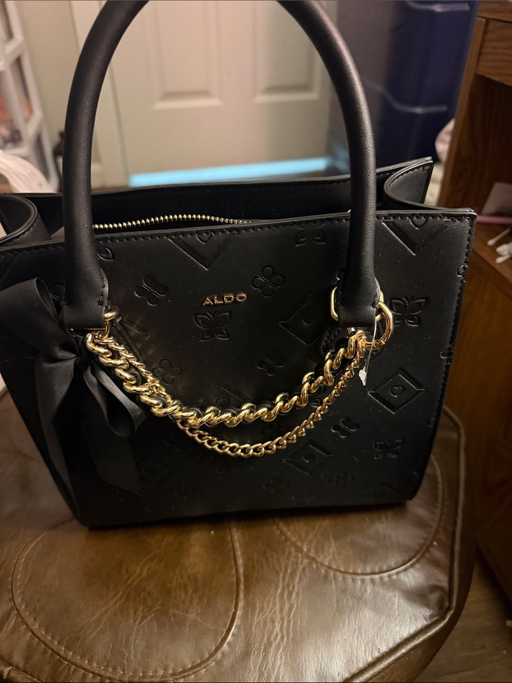 ALDO Black Satchel with Gold Chain and Bow Accent